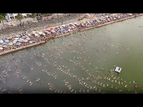 Swimmers float at Argentine Lake for world record attempt – YouTube